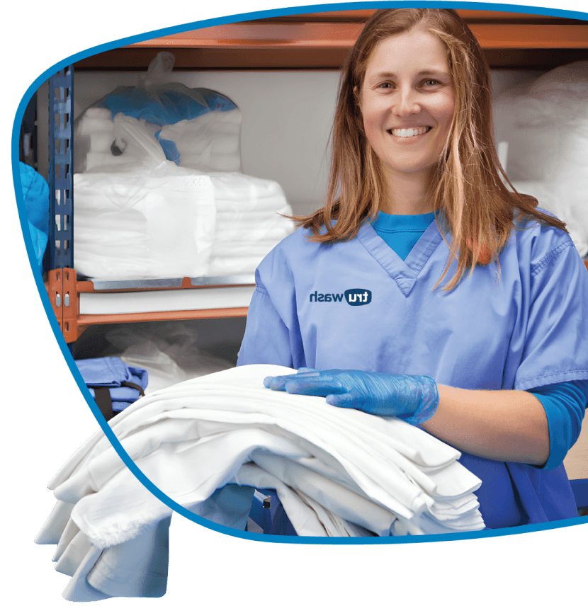 A person folding linens